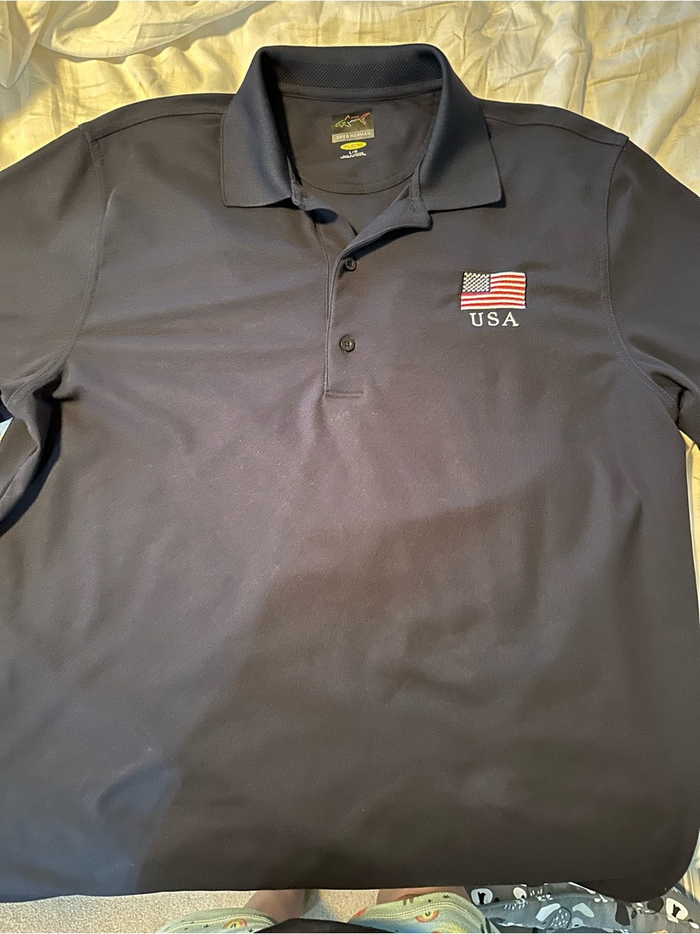Greg Norman Collection Navy Polo with USA Flag Embroidery